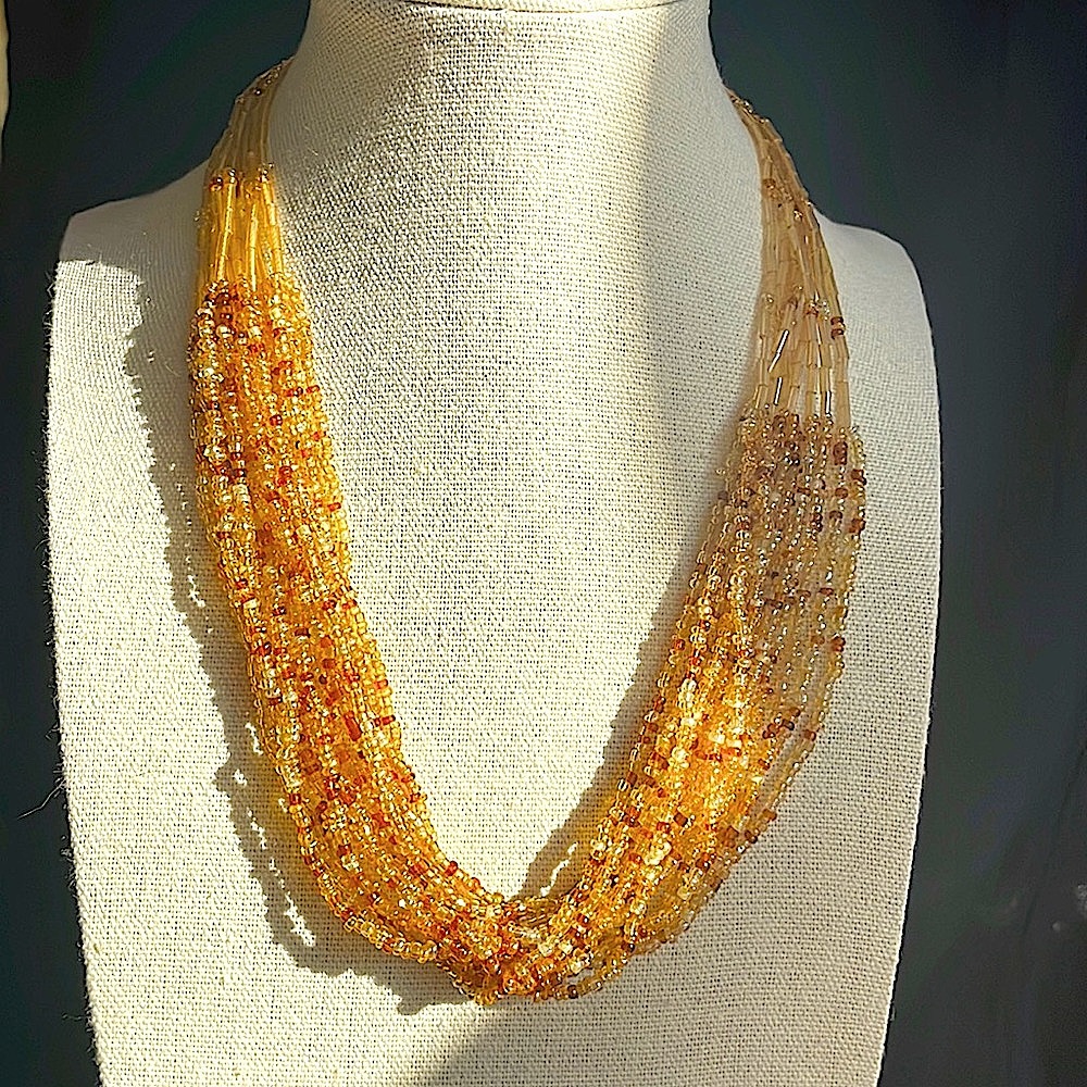 Golden seed bead multi strand necklace! Gorgeous over a T or under a collar!